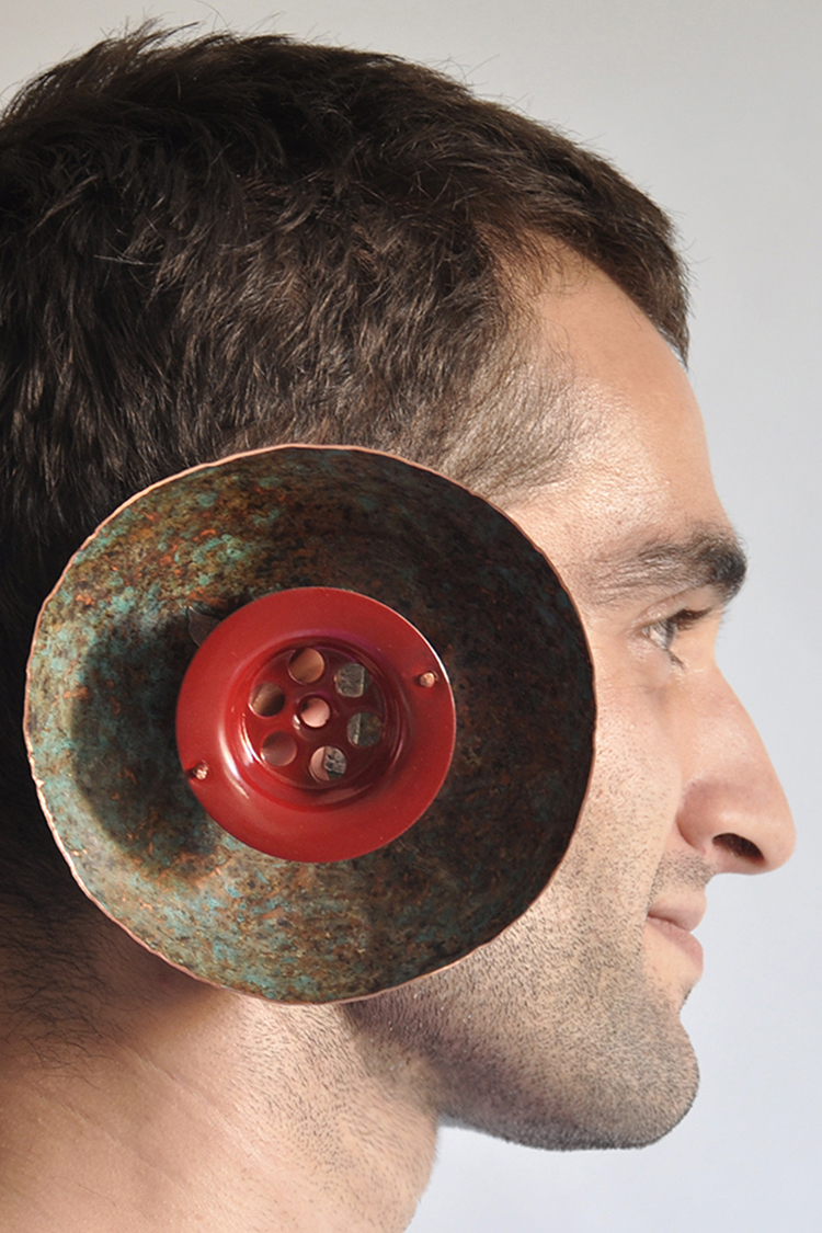 hand fabricated earpiece made of forged patinated copper and a drain part